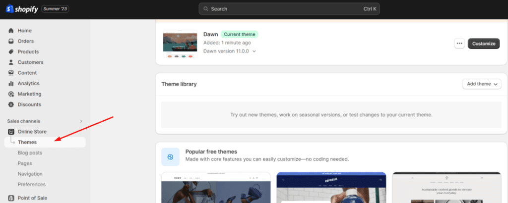 Arrow pointing towards themes tab under online store section in shopify theme